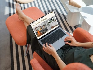 mockuuups-macbook-pro-mockup-with-a-woman-relaxing-on-a-chair